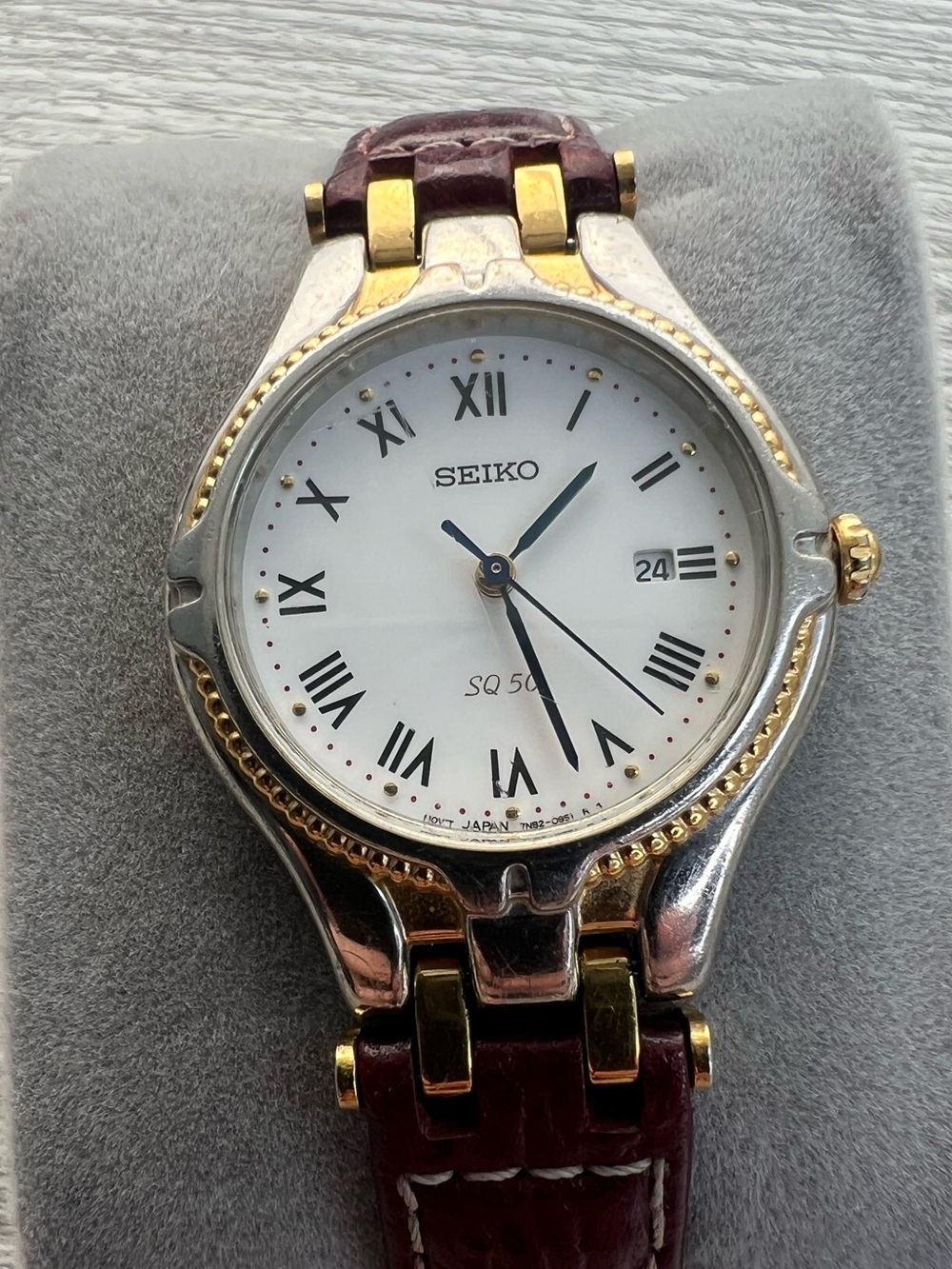 Seiko SQ 50 Silver and Gold Case Watch with White Dial and Leather Strap